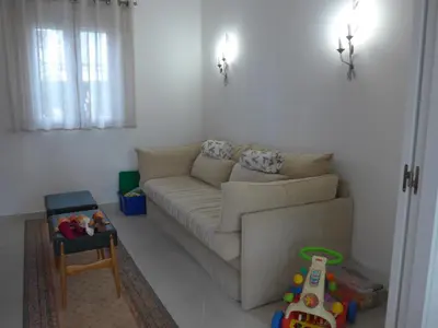 a living room with a couch and a childs toy at Casa Kiosko 1 bedroom ground floor with swimming pool in La Eliana