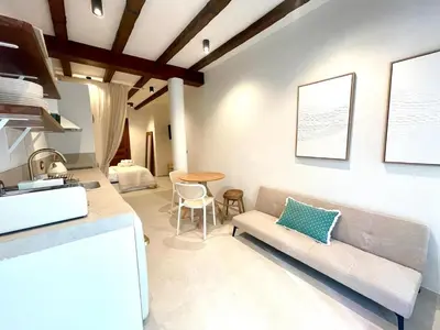 a living room with a couch and a table at Pepitos House in Valencia