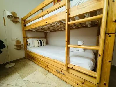 a couple of bunk beds in a room at ABAT 1 Cool & Wide Flat next to the Cathedral in Valencia