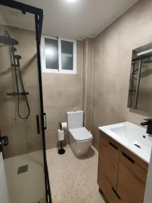a bathroom with a toilet and a sink and a shower at Playa Paradis III - Primera linea de playa in Moncófar