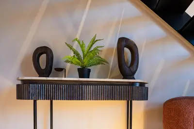 a table with a plant on top of it at City of Arts Valencia Flats by Rent Me in Valencia