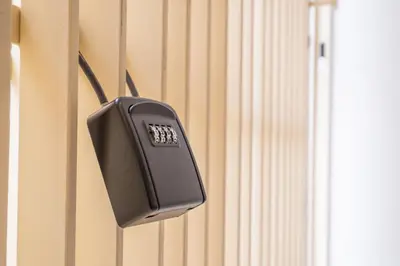 a phone is hanging on the side of a wall at Flats poeta serrano in Valencia