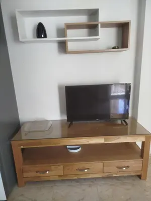 a entertainment center with a flat screen tv on top at Estudio cerca de la playa in Valencia