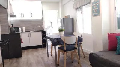 a white bathroom with a shower and a sink at Coqueto apartmento en Valencia in Valencia