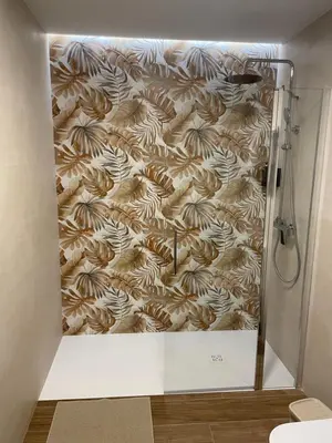 a shower in a bathroom with a brown and white wall at Central Park Flats by VIVOGC in Valencia
