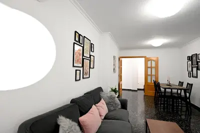 a living room with a couch and a table at EMMA Apartment in Puerto de Sagunto