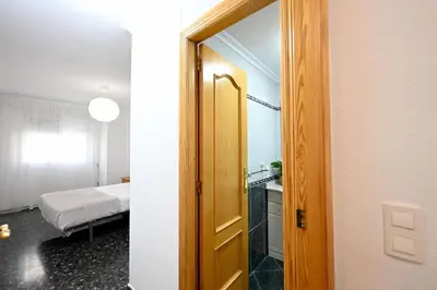a room with a door leading to a bedroom at EMMA Apartment in Puerto de Sagunto