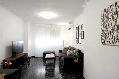 a living room with a couch and a table at EMMA Apartment in Puerto de Sagunto