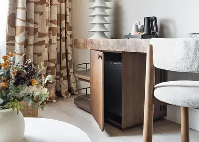 a living room with a table and a chair at One Shot Puerta Ruzafa in Valencia