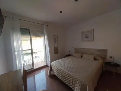 a wooden closet with a dresser with towels on it at Casa Santa Úrsula in Casinos