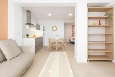 a living room with a couch and a table at Apartamentos Sol de Azahar in Valencia