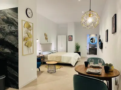 a bedroom with a bed and a table in a room at Ubicación inmejorable Hotel privado junto a la Ciudad de las Artes y a un paso del Turia in Valencia