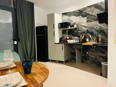 a bedroom with a bed and a clock on the wall at Ubicación inmejorable Hotel privado junto a la Ciudad de las Artes y a un paso del Turia in Valencia