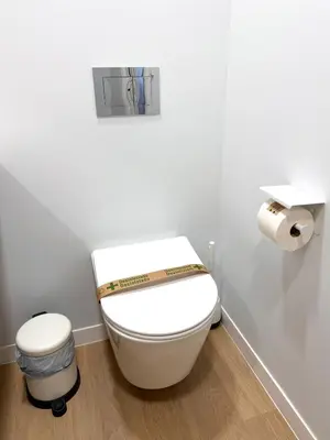 a bathroom with a toilet with a roll of toilet paper at Exclusive beachfront apartment in Valencia