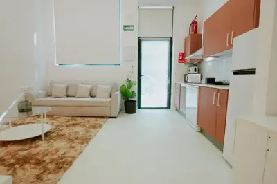 a living room with a couch and a table at Apartment 2 City of Arts and Science Fast Wifi 2 in Valencia