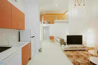 a kitchen with a sink and a tv in a room at Apartment 2 City of Arts and Science Fast Wifi 2 in Valencia