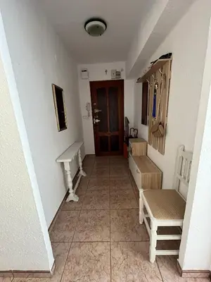 a hallway with a sink and a bench in a room at Apartament Marina Cullera in Cullera