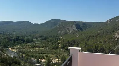 a view of a valley in the mountains at Vistas del Frailecico in Chulilla
