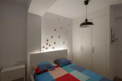 a bedroom with a bed with a colorful blanket at GuestReady - Homely escape in Valencia in Valencia