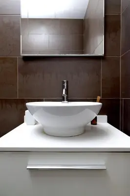 a white sink in a bathroom with a mirror at Grand Central Market Suites By VALENCIAFLATS EU in Valencia