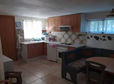 a kitchen with a sink and a stove top oven at Ferienwohnung mit Privatpool Casa Wende in Benaguacil