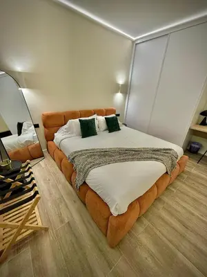 a bedroom with a large bed in a room at Tao Suite 1 next to the Aquarium in Valencia
