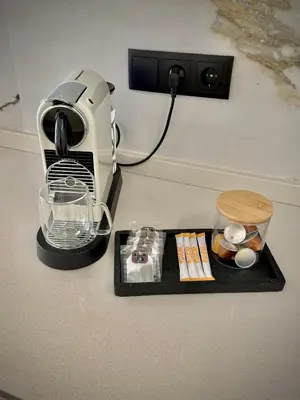 a food processor sitting on a counter next to a plate at Tao Suite 1 next to the Aquarium in Valencia