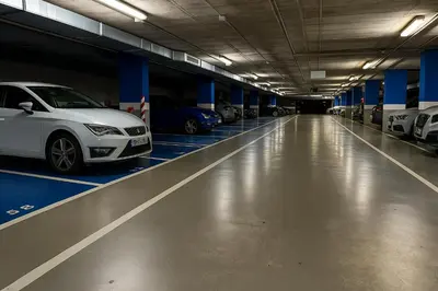 a car garage with several cars parked in it at Panoramic Suites By VALENCIAFLATS EU in Valencia