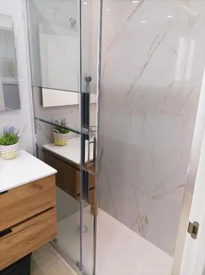 a shower with a glass door in a bathroom at Marti, 7-38 in Cullera