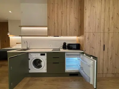 a kitchen with a washer and a washing machine at Apartamentos Nou Mestalla in Valencia