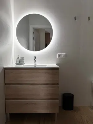 a bathroom with a sink and a mirror at Apartamentos Nou Mestalla in Valencia