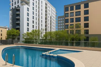 a swimming pool in a city with tall buildings at Resort & Suites Ciudad de las Ciencias By VALENCIAFLATS EU in Valencia