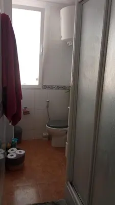 a bathroom with a toilet and a window at Malva Arena in Valencia