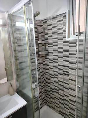 a bathroom with a shower and a glass shower stall at Agui House in Valencia