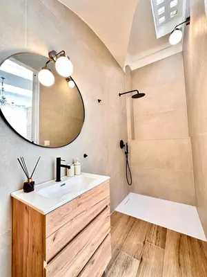 a bathroom with a sink and a mirror at Mediterranean Apartament in Valencia