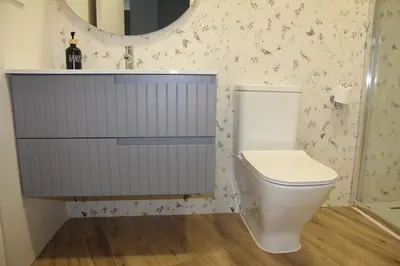 a bathroom with a toilet and a sink and a mirror at Ruzafa Tropical in Valencia
