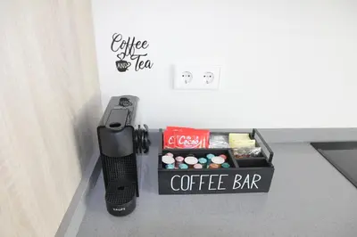 a cell phone and a coffee bar in a room at Ruzafa Tropical in Valencia