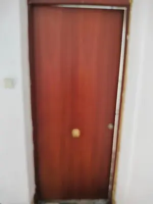 a wooden door in a room at Calle platano37 in Valencia