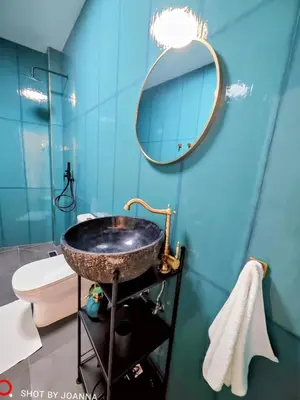 a bathroom with a sink and a mirror at Royal Lux in Sagunto