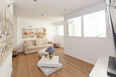 a living room with a couch and a table at GuestReady - Charming place in Valencia in Valencia