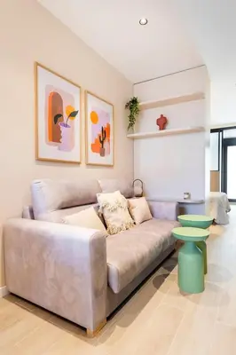 a living room with a couch and a table at Lujoso apartamento en Ruzafa in Valencia