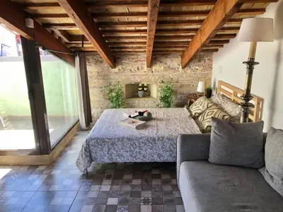 a living room with a couch and a table at Beautiful penthouse with two terraces near the sea in Valencia