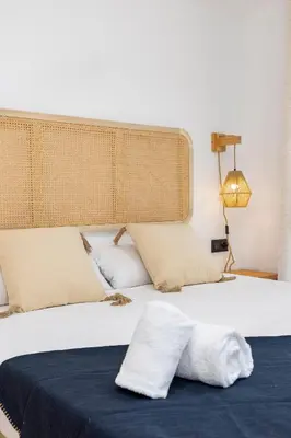 a bedroom with a large white bed with two pillows at Travel Habitat - Apartamento Familiar & Espacioso de 3 Dormitorios in Valencia