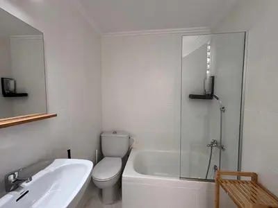 a bathroom with a toilet and a sink and a shower at VMC Rooms in Tavernes de Valldigna