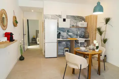 a kitchen and dining room with a table and a refrigerator at DM1 - Loft Valencia in Valencia