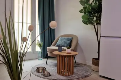 a living room with a chair and a table at DM1 - Loft Valencia in Valencia