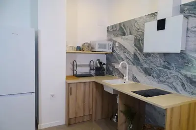 a kitchen with a sink and a refrigerator at DM1 - Loft Valencia in Valencia