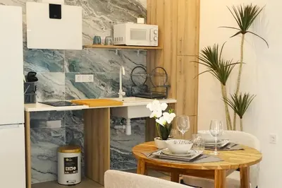 a dining room with a table and a microwave at DM1 - Loft Valencia in Valencia