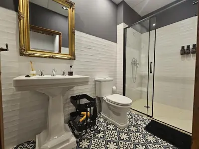 a bathroom with a sink and a toilet and a shower at Luxury apartament, close to Cabañal Beach, Late Checkout in Valencia