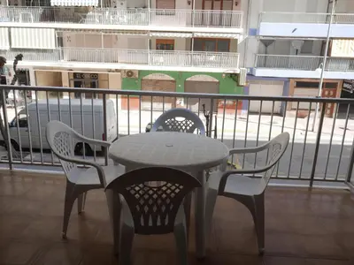 a table and chairs sitting on top of a balcony at Levante, 1-N in Cullera